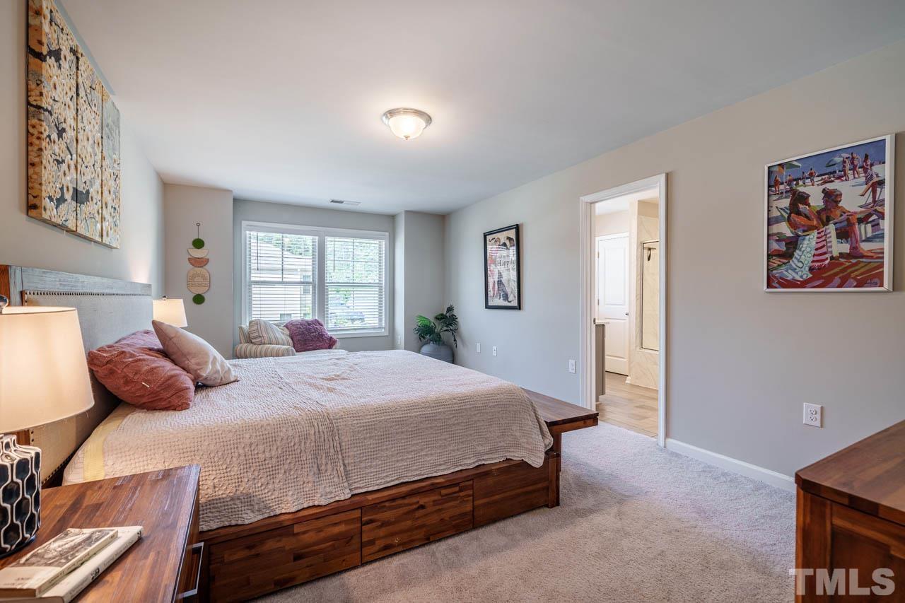 1007 Longitude Drive Durham, NC 27713 - Photo 18 of 35 a bedroom with a bed and a window