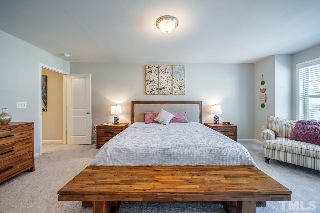 1007 Longitude Drive Durham, NC 27713 - Photo 20 of 35 a bedroom with a bed and dresser