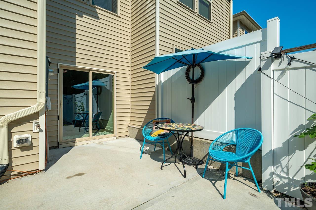 1007 Longitude Drive Durham, NC 27713 - Photo 30 of 35 a backyard of a house with table and chairs