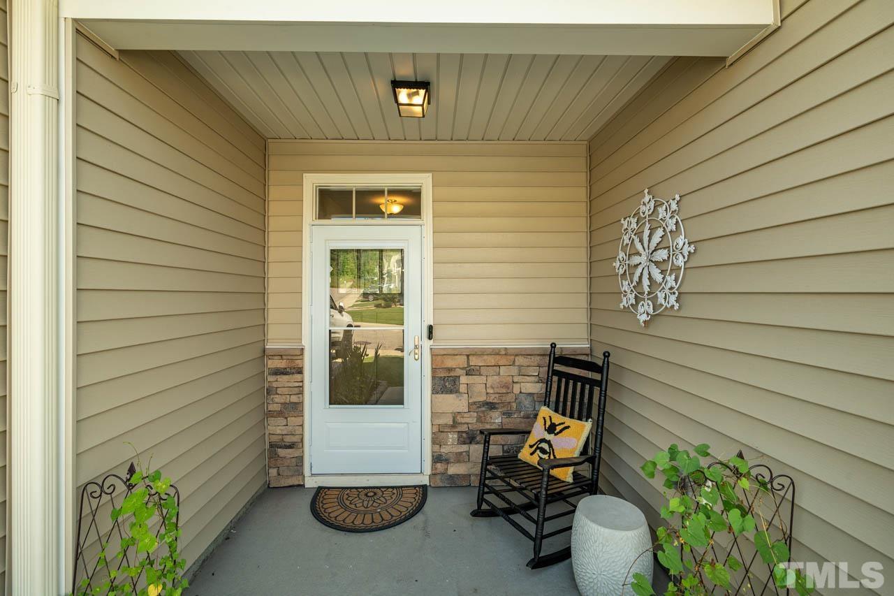 1007 Longitude Drive Durham, NC 27713 - Photo 3 of 35 a view of patio with a table and chairs and potted plants