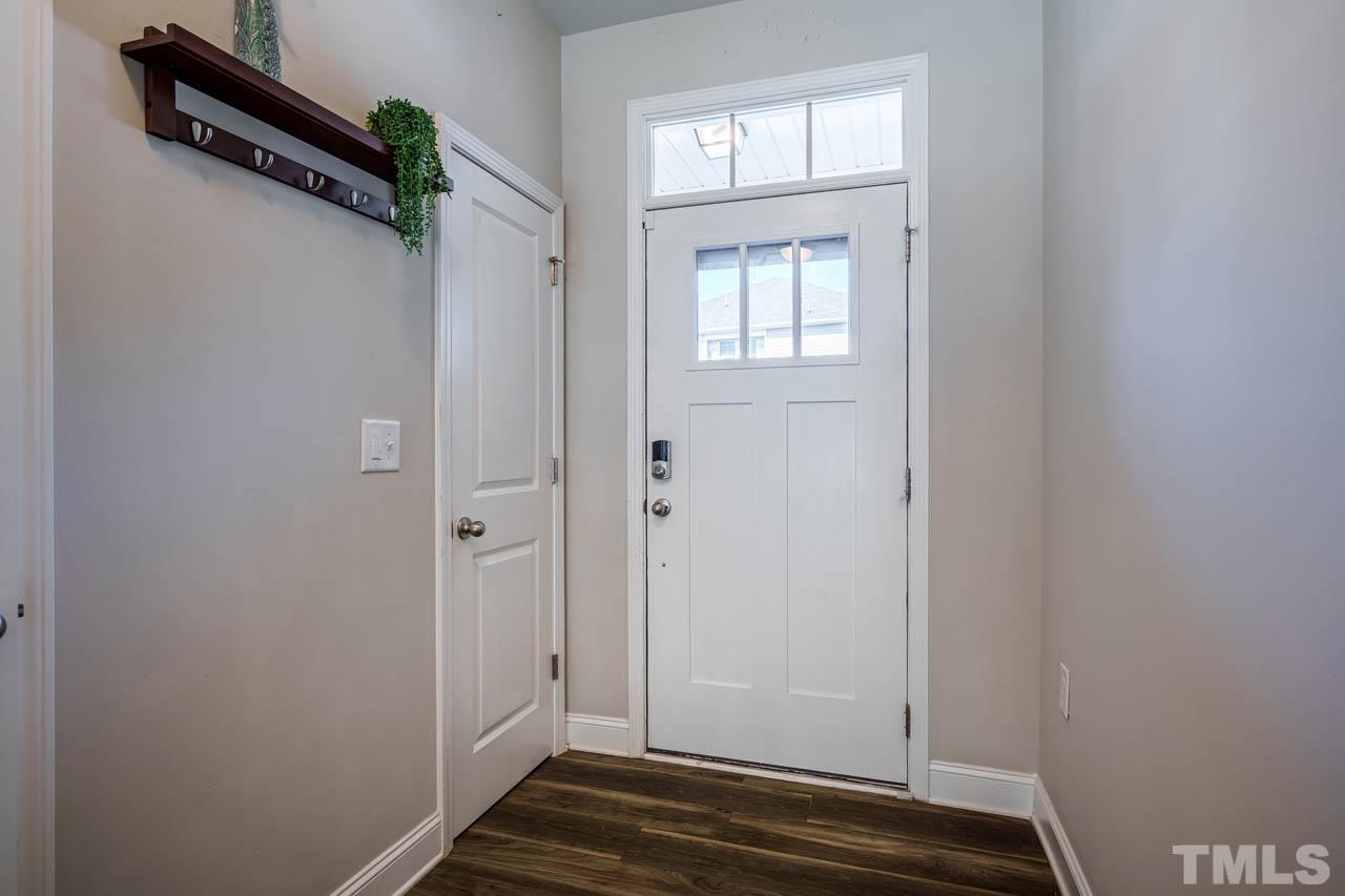 1007 Longitude Drive Durham, NC 27713 - Photo 4 of 35 a view of a room with wooden floor and windows