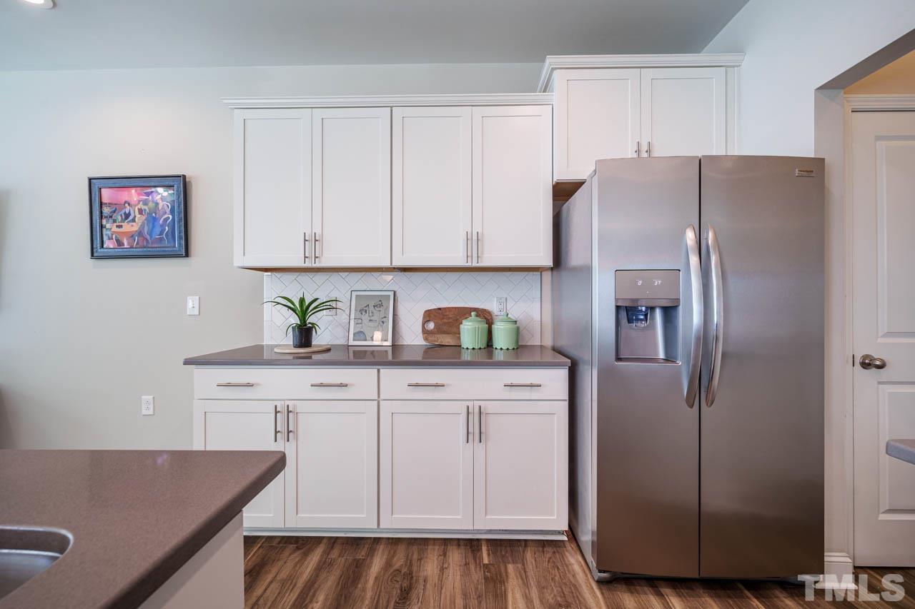 1007 Longitude Drive Durham, NC 27713 - Photo 8 of 35 a kitchen with stainless steel appliances granite countertop a refrigerator and a stove