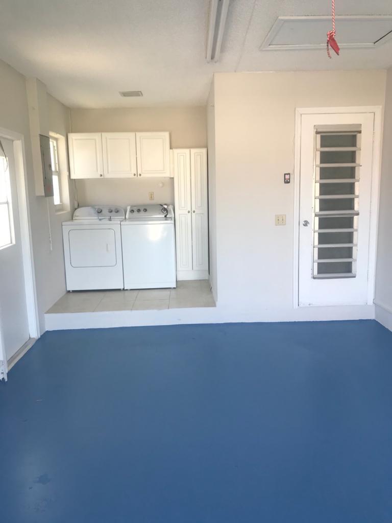 22307 Doran Avenue Boca Raton, FL 33428 - Photo 12 of 25 an empty room with wooden floor and windows