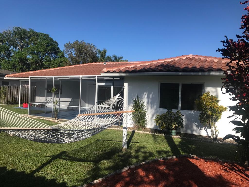 22307 Doran Avenue Boca Raton, FL 33428 - Photo 14 of 25 a view of house with backyard and garden