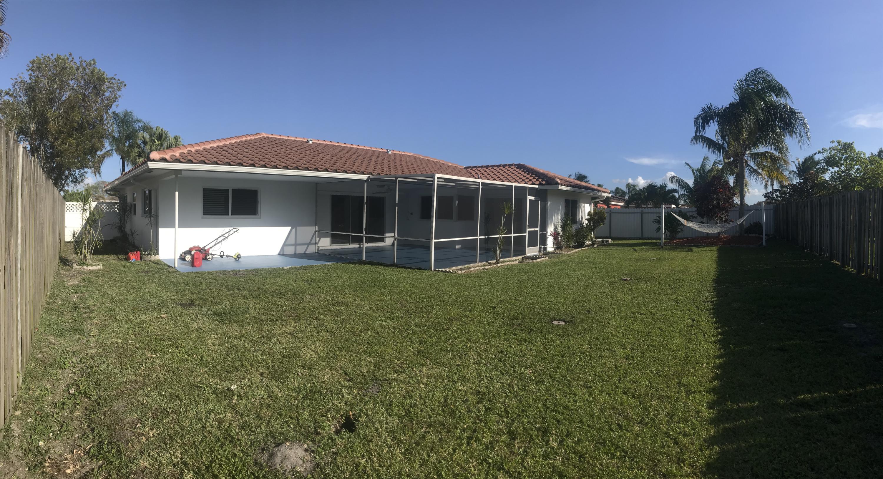 22307 Doran Avenue Boca Raton, FL 33428 - Photo 16 of 25 a view of a house with backyard and porch