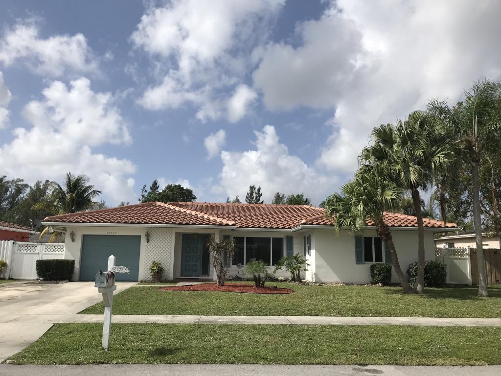 22307 Doran Avenue Boca Raton, FL 33428 - Photo 25 of 25 a front view of a house with a yard