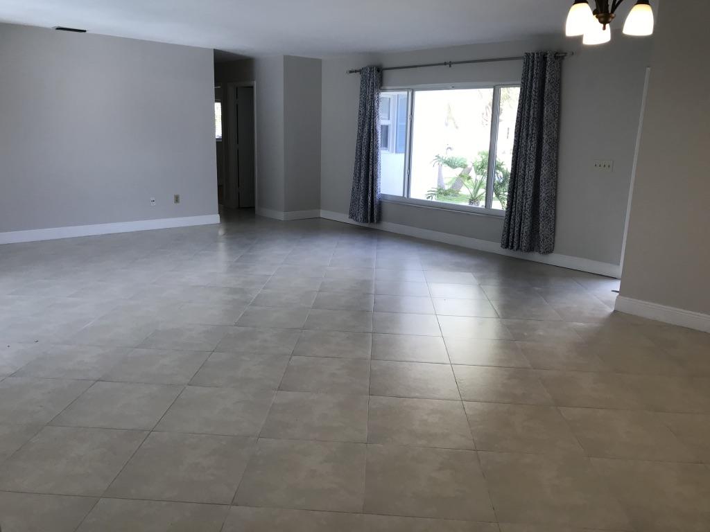 22307 Doran Avenue Boca Raton, FL 33428 - Photo 6 of 25 an empty room with windows and entrance
