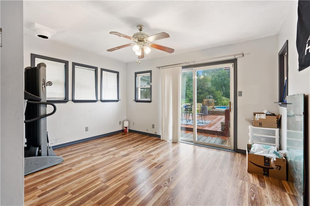 487 B Blockhouse Run Road New Brighton, PA 15066 - Photo 11 of 25 Sunroom/Family Room offers access to deck area