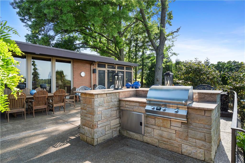 1789 Hastings Mill Road Pittsburgh, PA 15241 - Photo 36 of 47 a view of a patio with table and chairs with wooden floor and fence