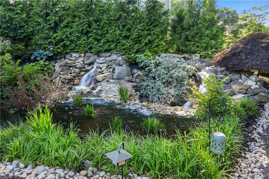 1789 Hastings Mill Road Pittsburgh, PA 15241 - Photo 45 of 47 a view of a garden with a lake