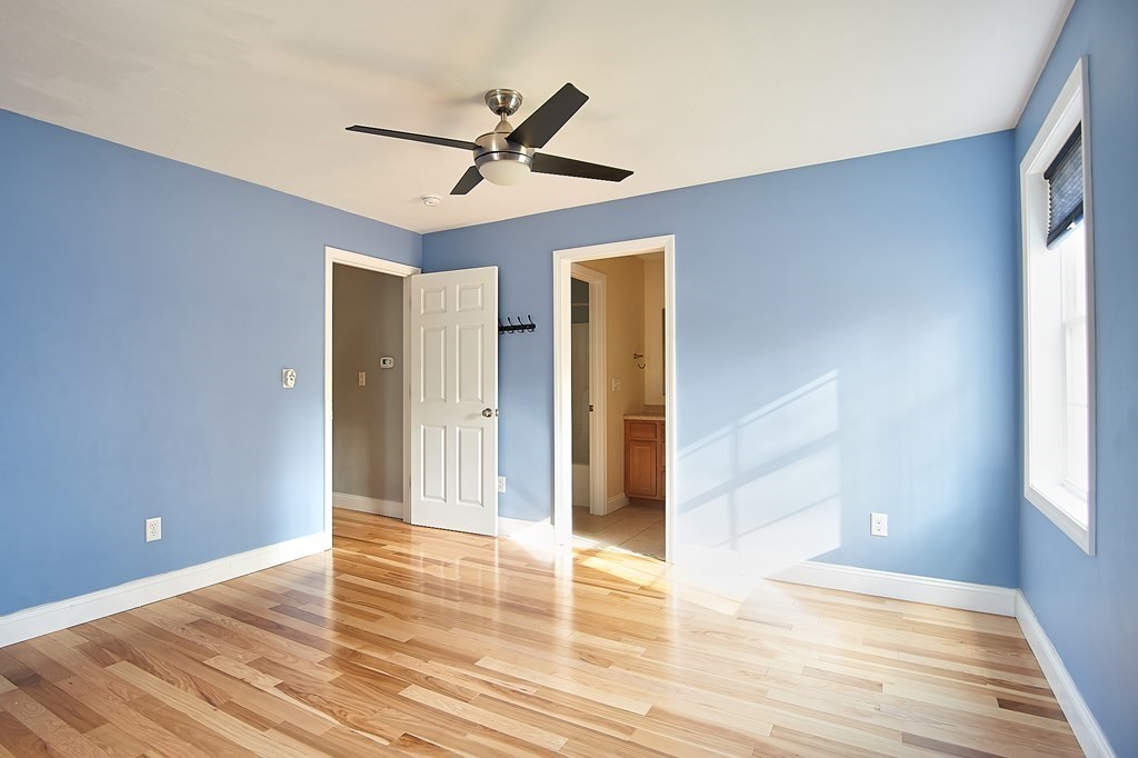 4 Alyssa Drive Townsend, MA 01469 - Photo 19 of 35 a view of a livingroom with wooden floor and a ceiling fan