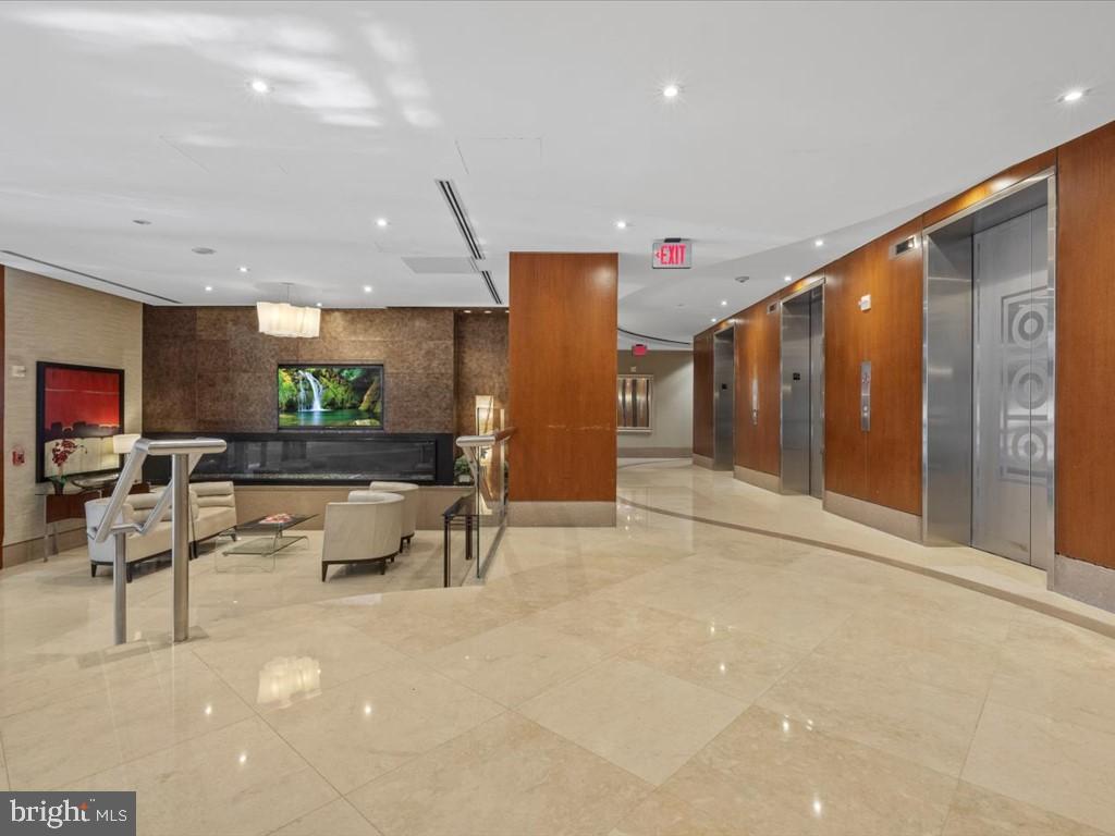 811 4th Street Northwest, Unit 608 Washington, DC 20001 - Photo 3 of 22 a living room with furniture and a large window