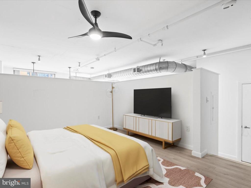 811 4th Street Northwest, Unit 608 Washington, DC 20001 - Photo 6 of 22 a bedroom with double bed and a flat tv screen