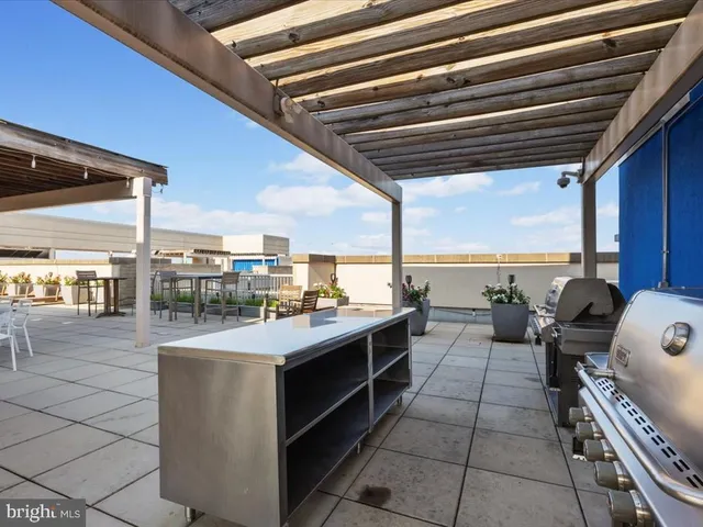 a kitchen with a stove a sink and a microwave