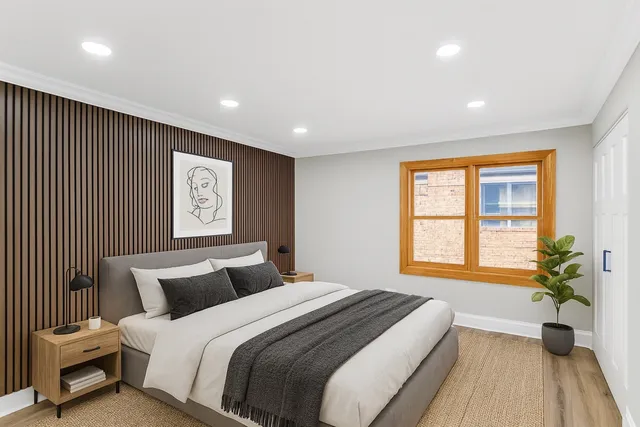 a bedroom with bed and window