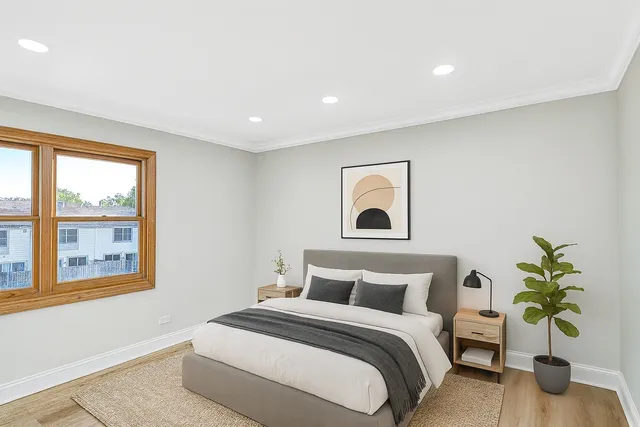 a bedroom with bed and a window