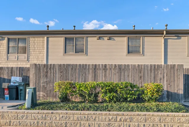 a view of a back yard from a balcony