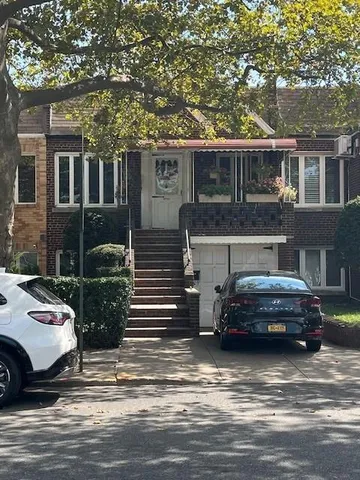 a car parked in front of a house