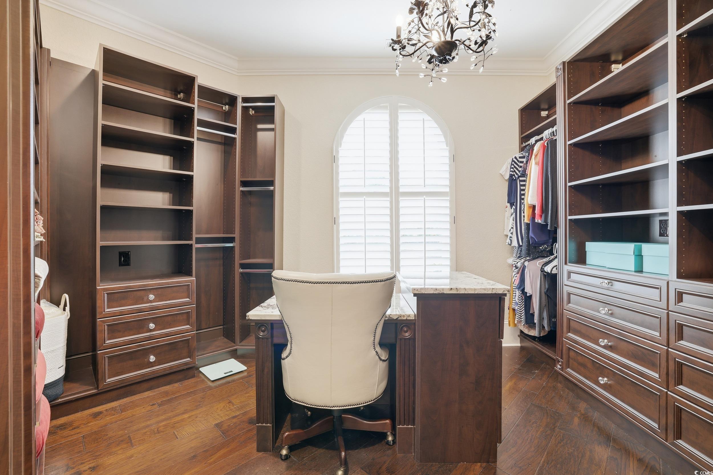 9552 Lugano Court Myrtle Beach, SC 29579 - Photo 25 of 40 Spacious closet featuring dark wood finished floors and a chandelier
