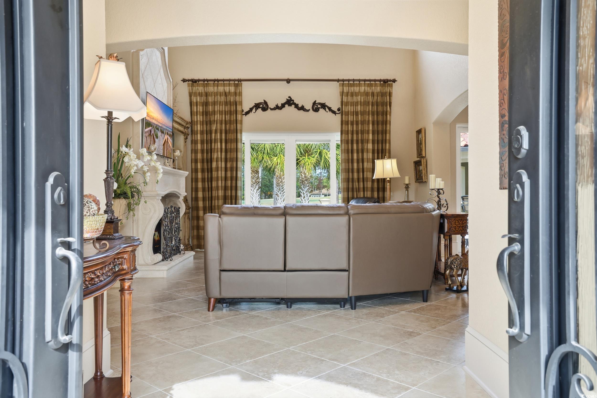 9552 Lugano Court Myrtle Beach, SC 29579 - Photo 3 of 40 Tiled living room featuring arched walkways