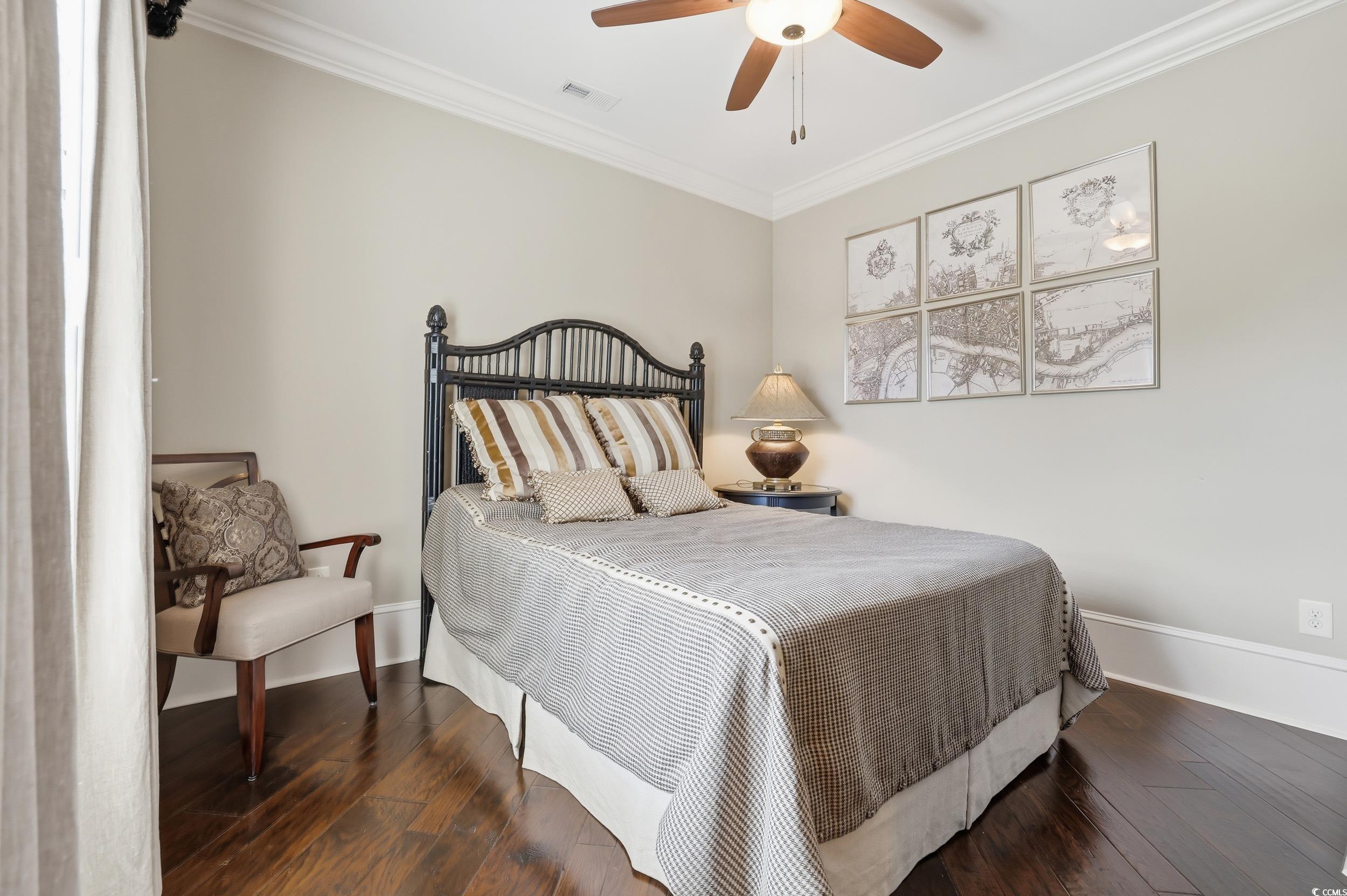 9552 Lugano Court Myrtle Beach, SC 29579 - Photo 30 of 40 Bedroom with ornamental molding, dark wood finished floors, and a ceiling fan