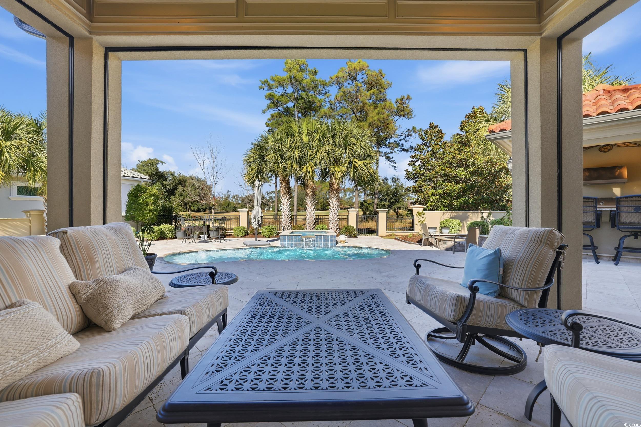 9552 Lugano Court Myrtle Beach, SC 29579 - Photo 35 of 40 Sunroom with tile patterned floors and a hot tub