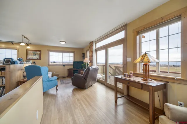 a living room with furniture and a table