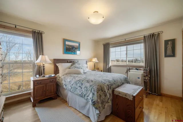 a bedroom with a bed and a night stand