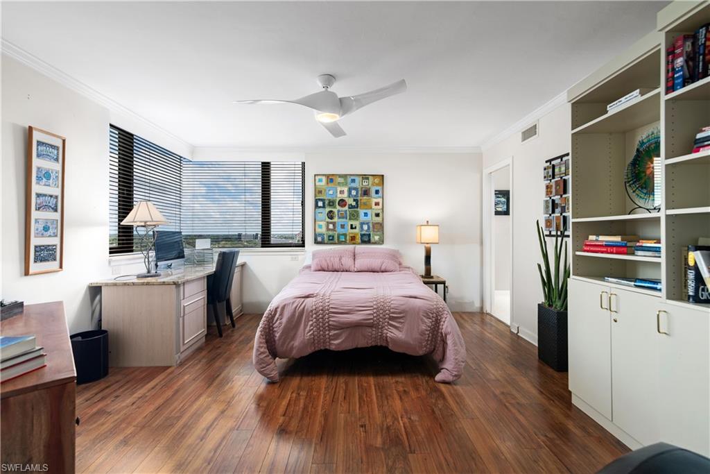 5555 Heron Point Drive, Unit 1202 Naples, FL 34108 - Photo 24 of 36 a bed room with a bed and a large window