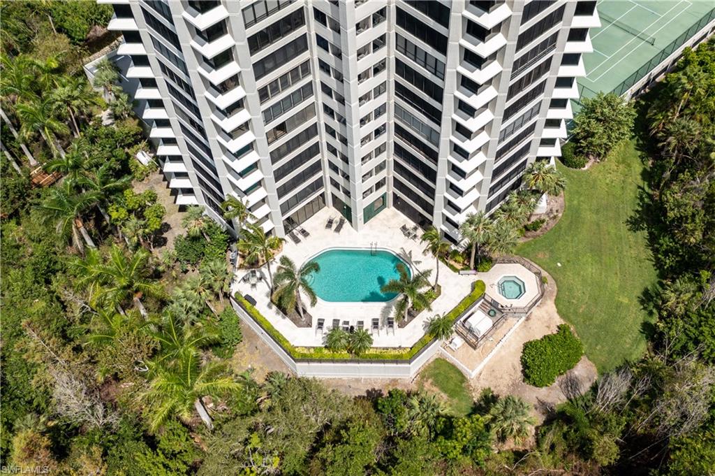 5555 Heron Point Drive, Unit 1202 Naples, FL 34108 - Photo 33 of 36 an aerial view of a house with a yard and green space