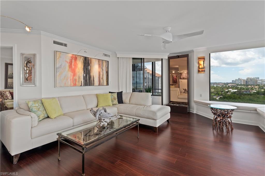 5555 Heron Point Drive, Unit 1202 Naples, FL 34108 - Photo 8 of 36 a living room with furniture and a large window