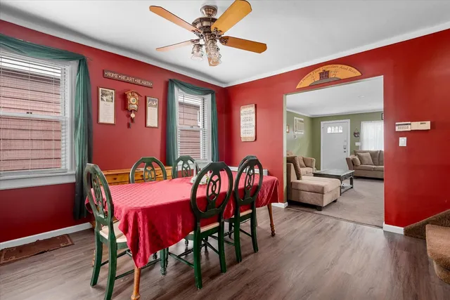 a view of a dining room with furniture window and wooden floor