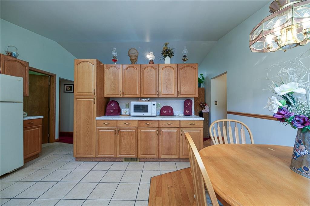 285 Glade Run Road Renfrew, PA 16053 - Photo 9 of 25 a kitchen with a refrigerator and a stove top oven