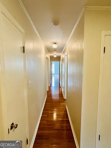a bathroom with a granite countertop sink a mirror and shower