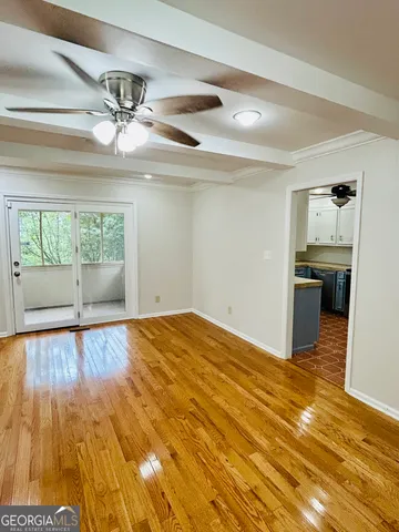 a large kitchen with stainless steel appliances granite countertop a sink and dishwasher a stove top oven with white cabinets