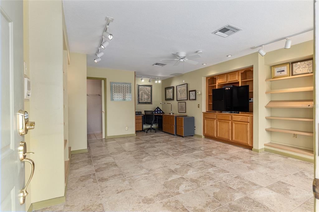 2215 Spring Hill Court Ocala, FL 34471 - Photo 57 of 62 a living room with furniture and a flat screen tv