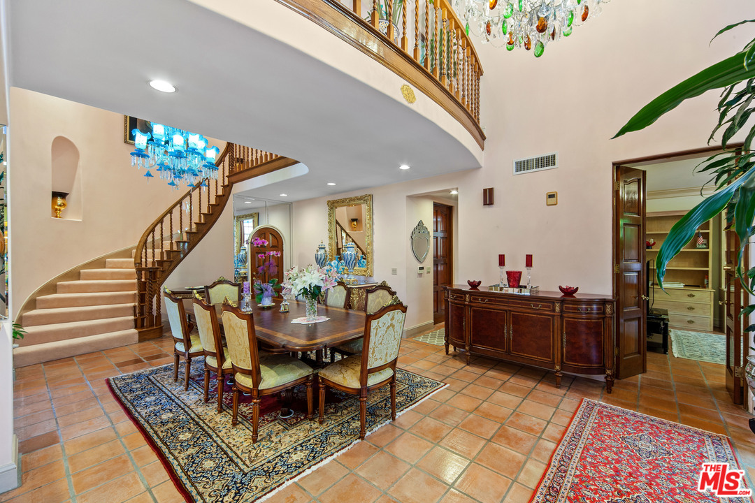 2113 Stoney Hill Road Los Angeles, CA 90049 - Photo 20 of 48 a dining room with furniture and entryway