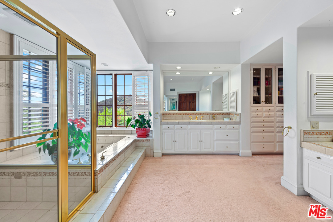 2113 Stoney Hill Road Los Angeles, CA 90049 - Photo 34 of 48 a view of a kitchen with furniture and large window
