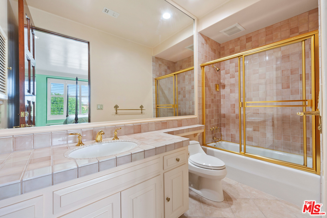 2113 Stoney Hill Road Los Angeles, CA 90049 - Photo 37 of 48 a bathroom with a sink toilet and shower