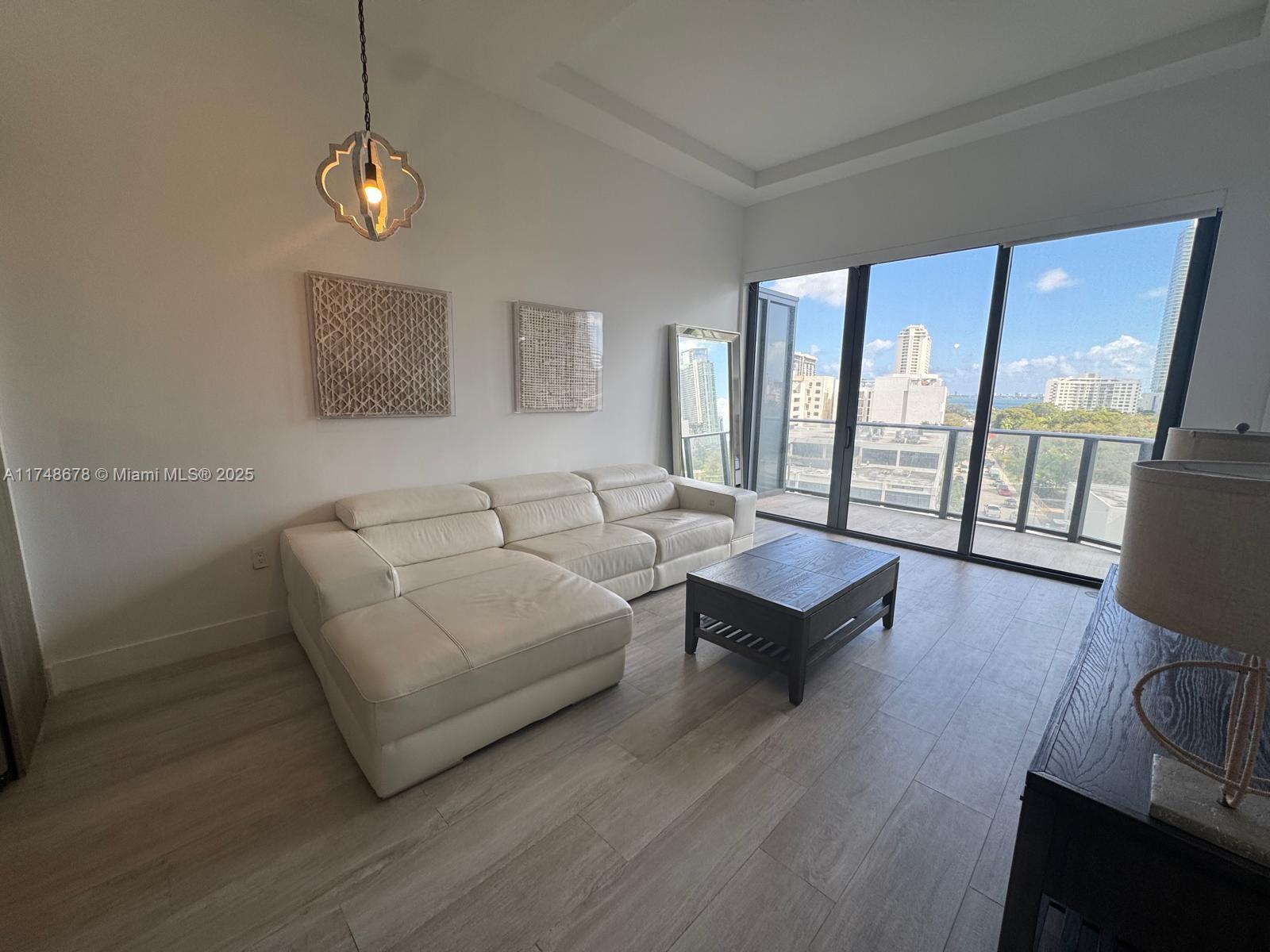 Midtown Miami Miami, FL 33137 - Photo 2 of 21 a living room with couches and a coffee table