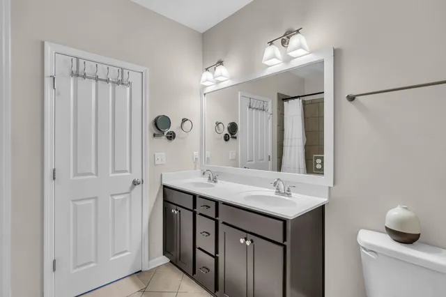 a bathroom with a sink and mirror