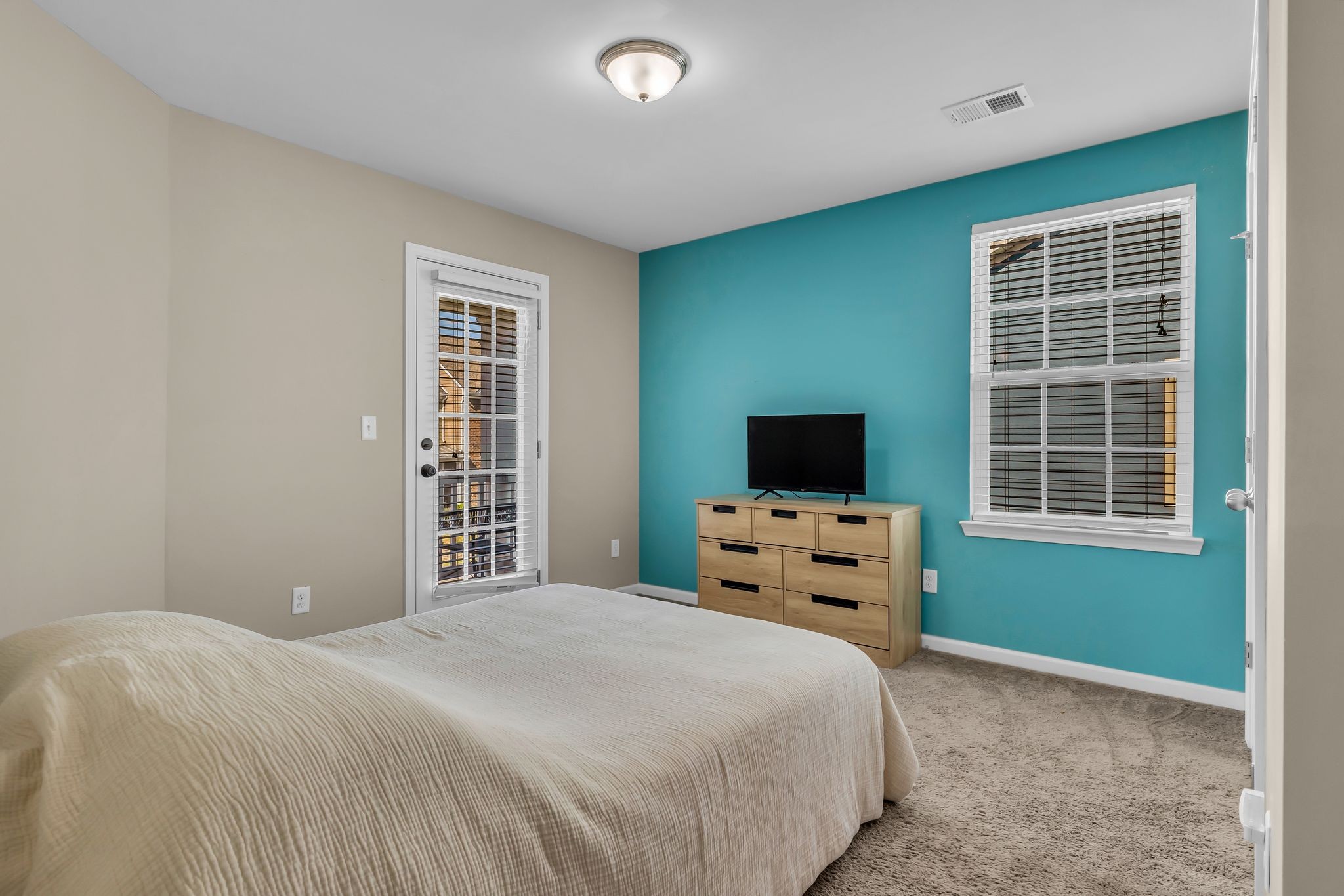 2091 Hemlock Drive Spring Hill, TN 37174 - Photo 17 of 25 a bedroom with a bed and flat screen tv