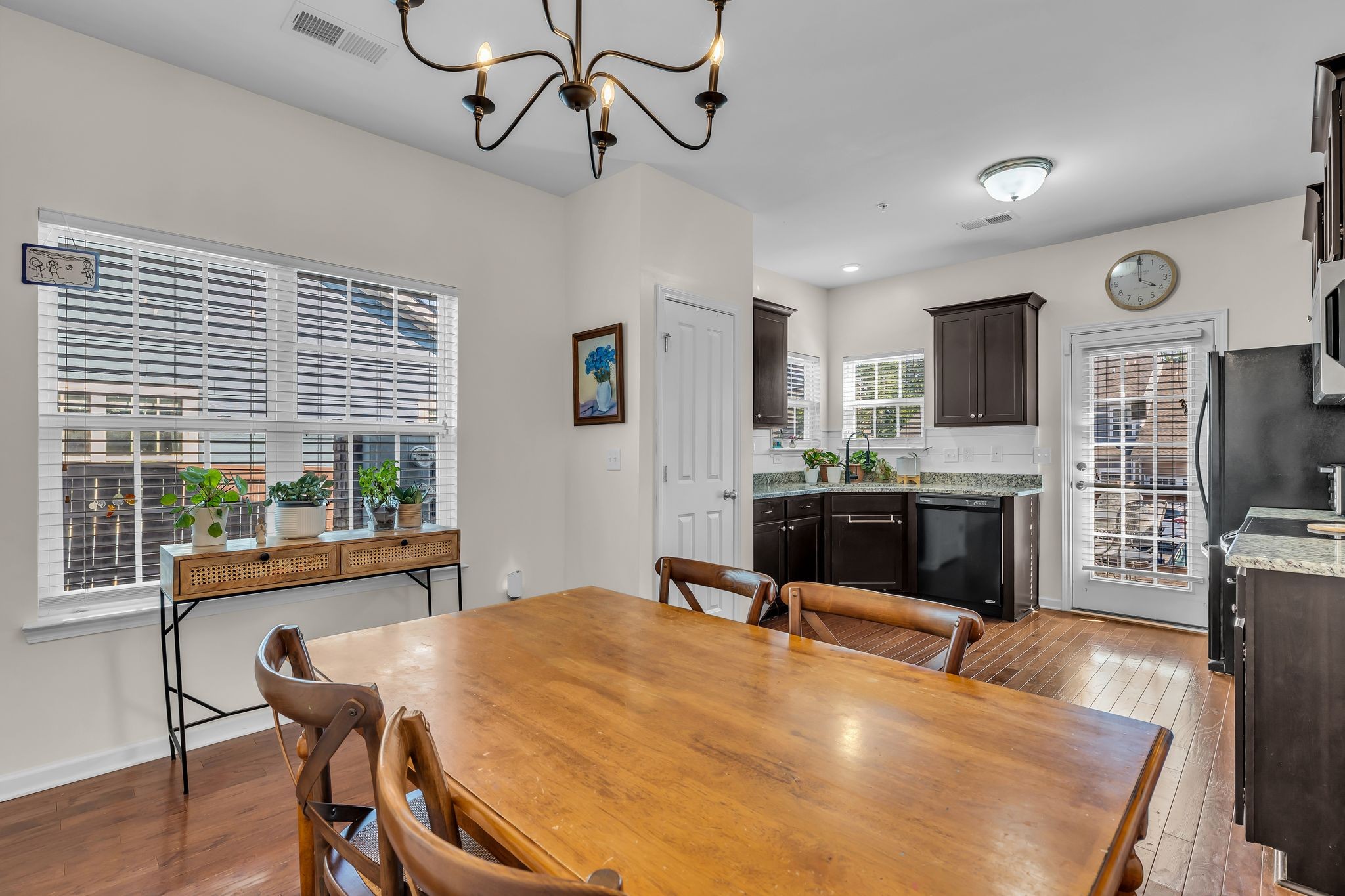 2091 Hemlock Drive Spring Hill, TN 37174 - Photo 6 of 25 a room with stainless steel appliances kitchen island granite countertop a table chairs in it and wooden floors