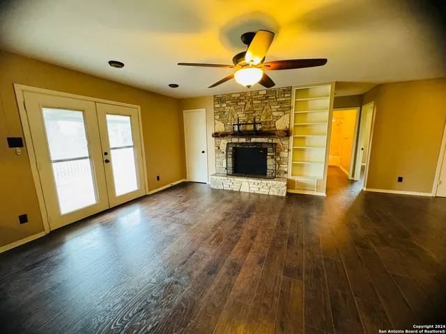 a view of a livingroom with wooden floor