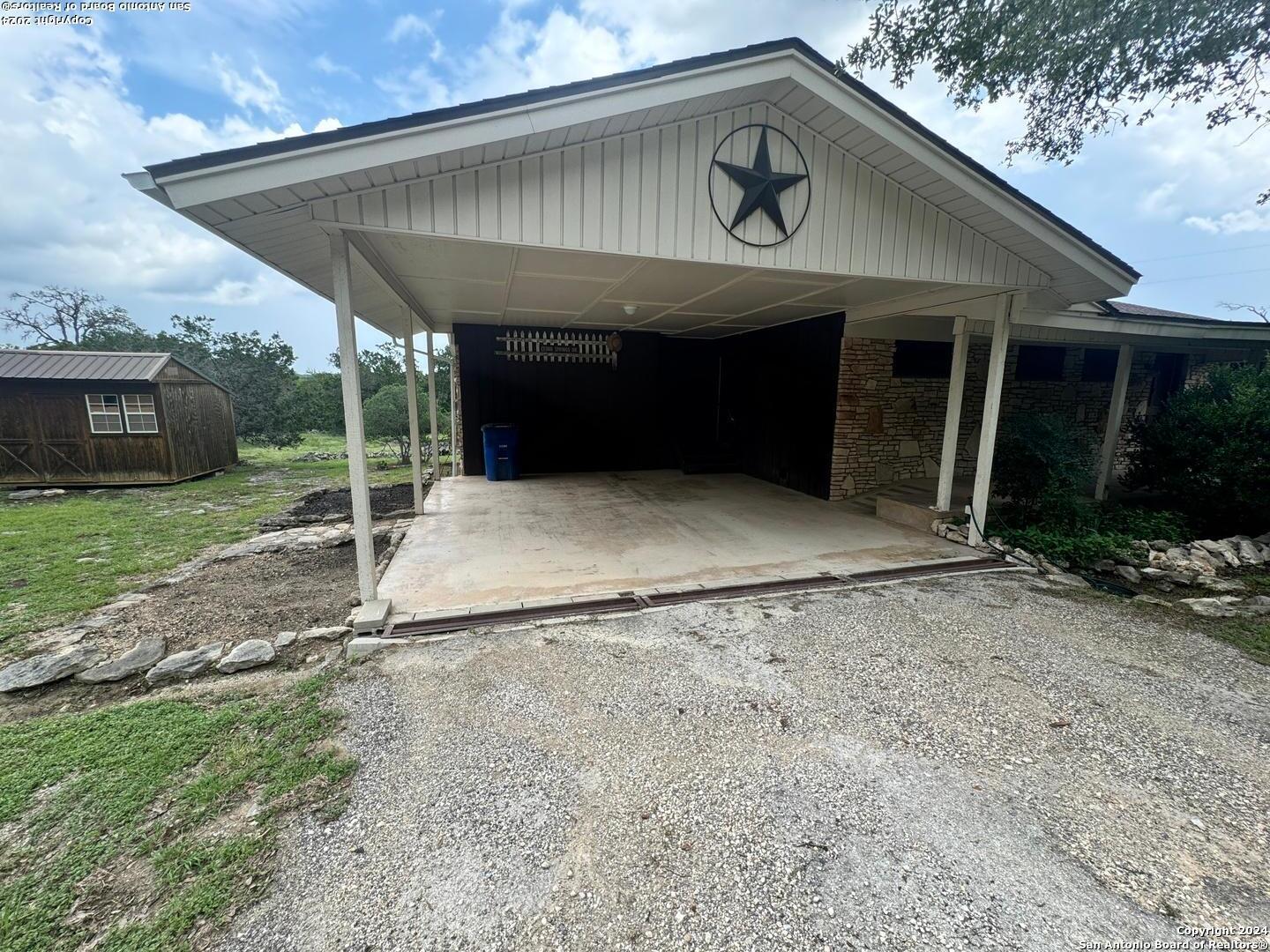 440 Cedar Springs Drive Spring Branch, TX 78070 - Photo 2 of 48 a front view of a house with garden