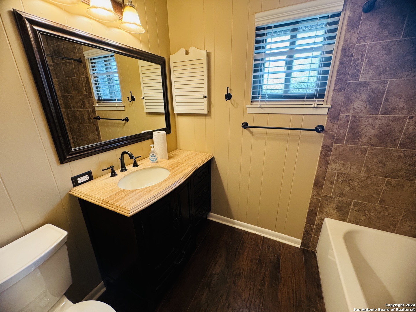 440 Cedar Springs Drive Spring Branch, TX 78070 - Photo 22 of 48 a bathroom with a sink a toilet a mirror and tub