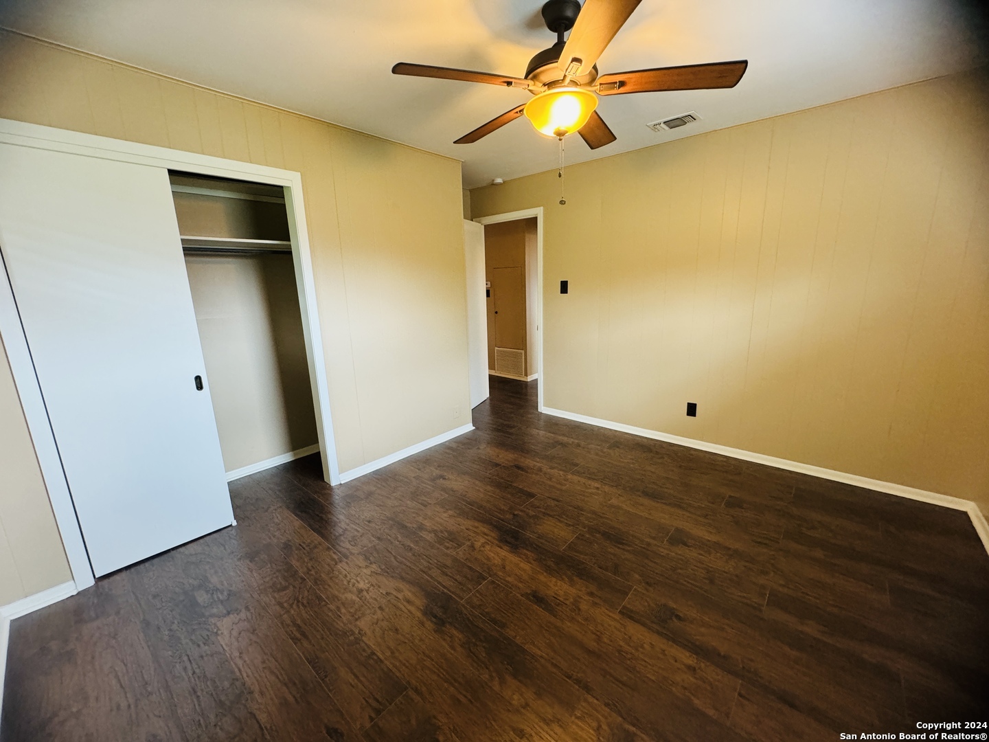 440 Cedar Springs Drive Spring Branch, TX 78070 - Photo 28 of 48 an empty room with wooden floor and fan