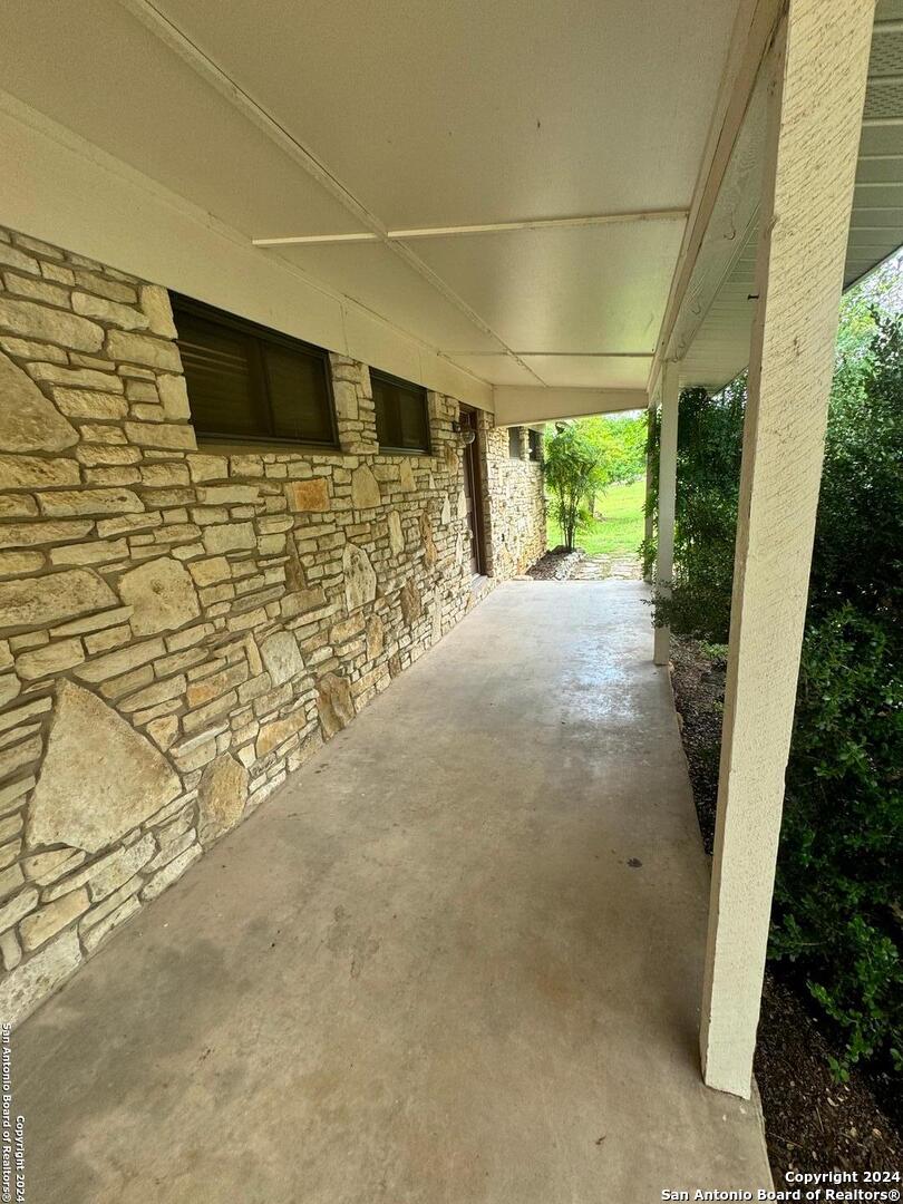 440 Cedar Springs Drive Spring Branch, TX 78070 - Photo 3 of 48 a view of a patio with table and chairs