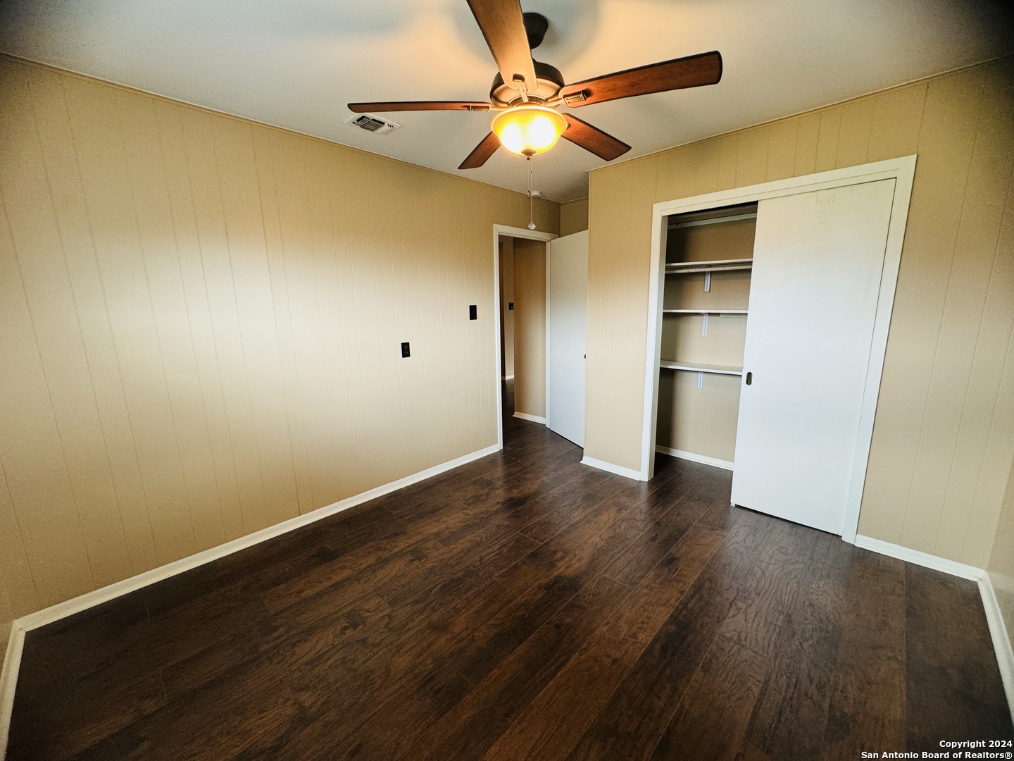 440 Cedar Springs Drive Spring Branch, TX 78070 - Photo 32 of 48 a view of empty room with wooden floor and fan