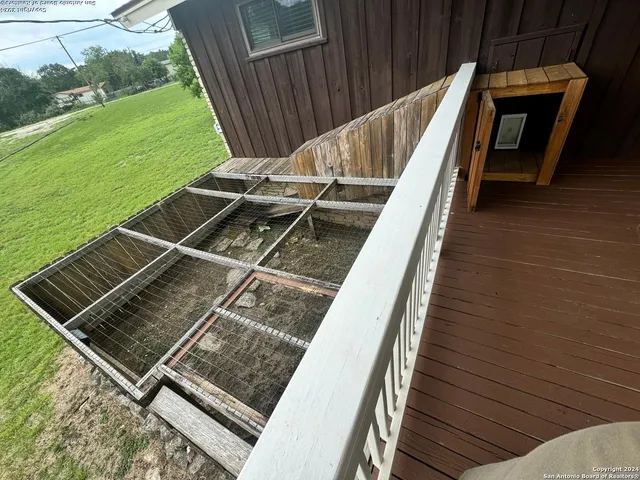 a view of a balcony with wooden floor